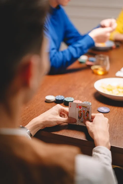 poker player holding a poker hand 2 hole