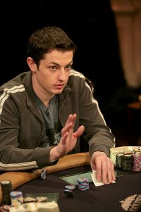 Tom Dwan sitting at a poker table